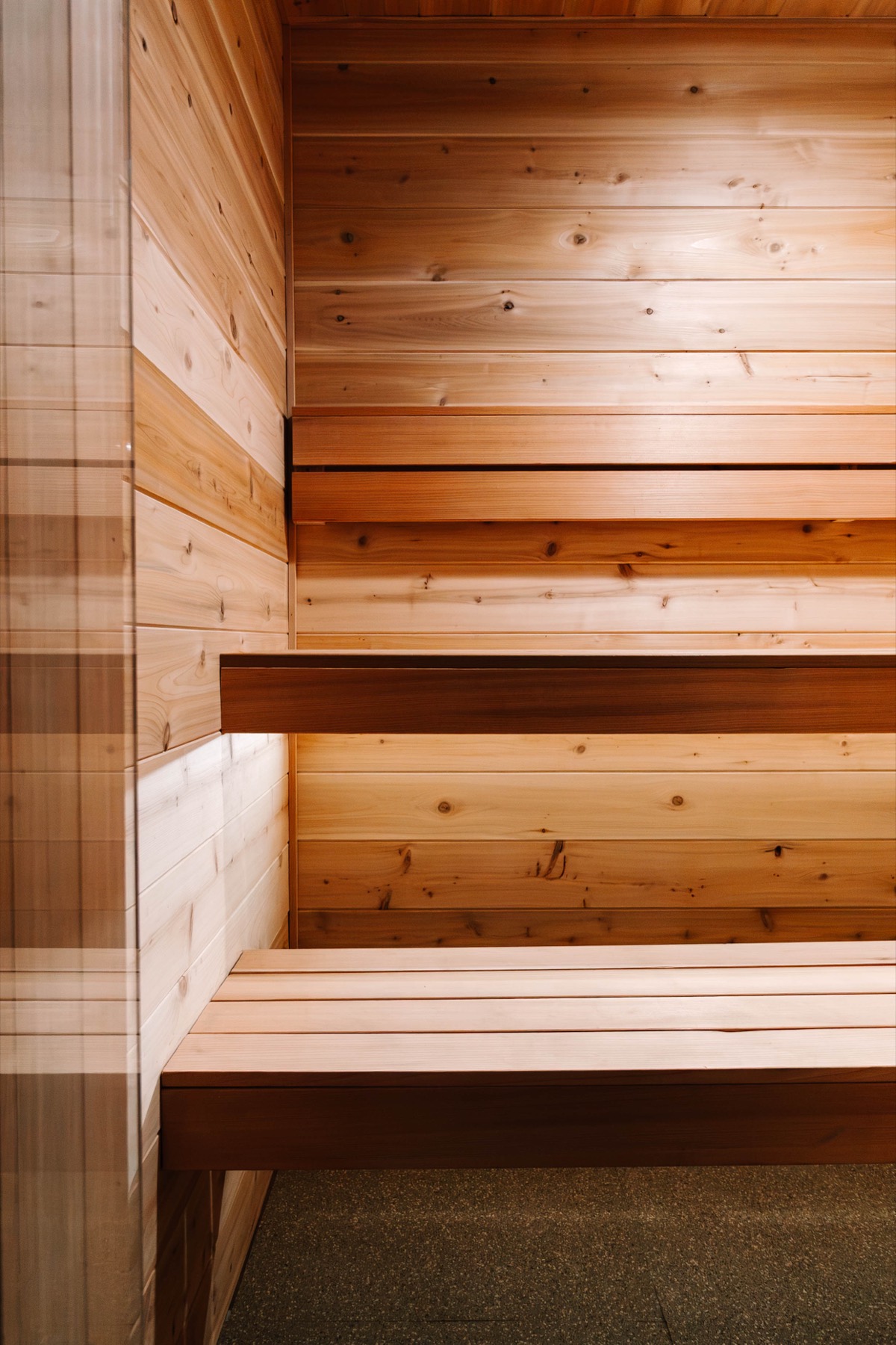 Cedar bench planes and wall paneling, near-abstract detail