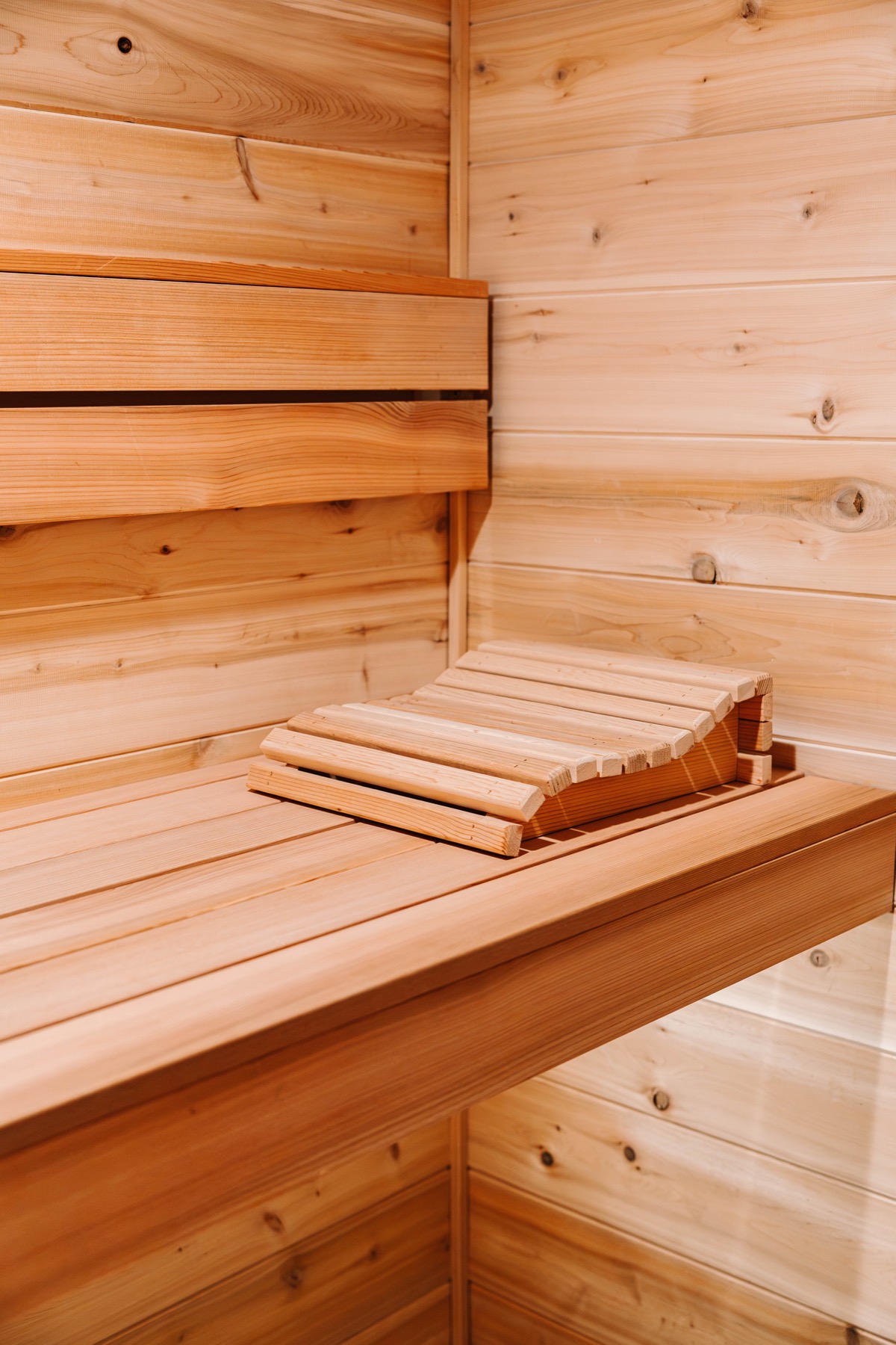 Cedar headrest resting on an upper bench